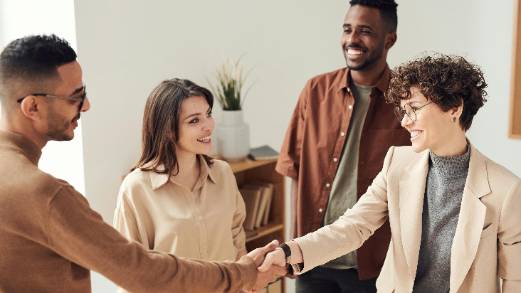 innovative fundraising meeting, engaged, presenting financial projections, photorealistic, advanced boardroom with digital interfaces, highly detailed, analytical discussions, detailed charts, cool gray and blue, direct overhead lighting, shot with a 16-35mm camera lens.