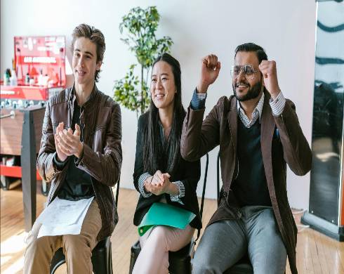 dynamic loan startup, determined expression, planning, photorealistic, sleek office setting with digital devices and loan documents, highly detailed, fast-paced activity, crisp details, monochromatic scheme with pops of color, artificial soft lighting, shot with a 24mm lens